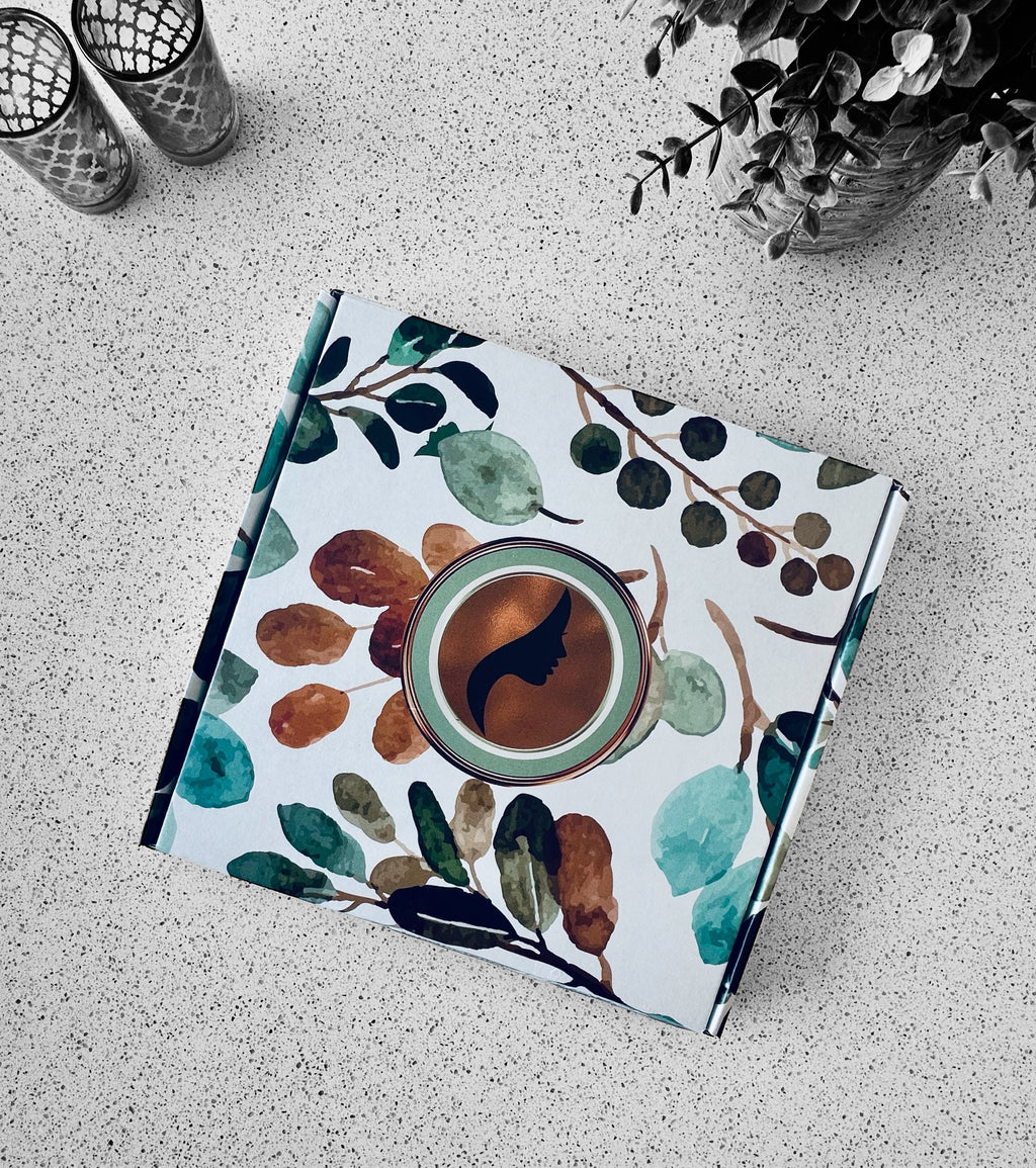 Notebook with a floral and coffee design on a textured surface